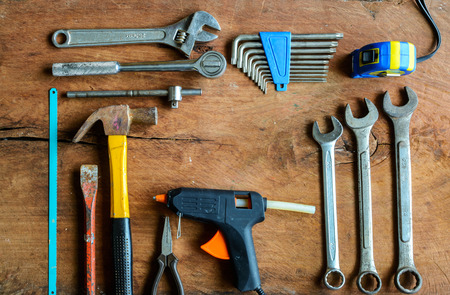 Set of work tools on old grunge wood background with copy spaceの写真素材