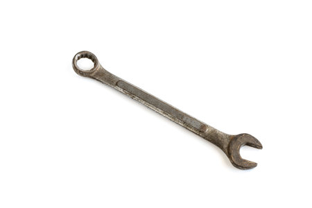 Old rusty wrench isolated on white background