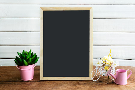 Shelf decoration with blackboard and flower on white background, Vintage styleの写真素材