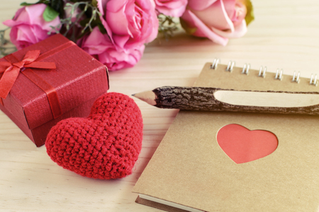 Blank notepad with red gift box and red heart shape, Valentine's day conceptの写真素材