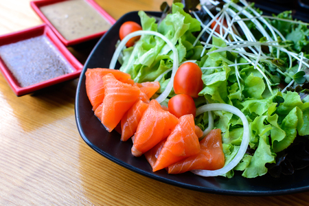 Salmon salad japanese style on wooden tableの写真素材