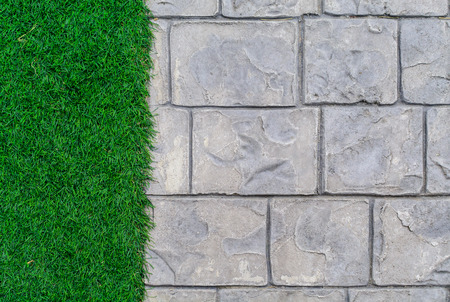 Ornament Stone footpath with pebble and grass in the gardenの写真素材