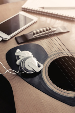 Close up of earpiece with cellphone on guitar with softlight, Vintage toneの写真素材