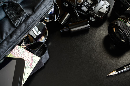 Outfit of traveler on black background and copy space,Travel conceptの写真素材
