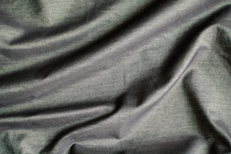 rippled black silk fabric background and textile