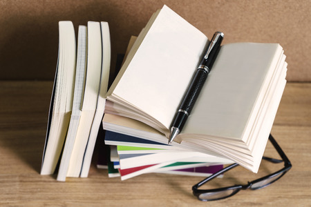 Stack of books on wooden table, Education backgroundの写真素材