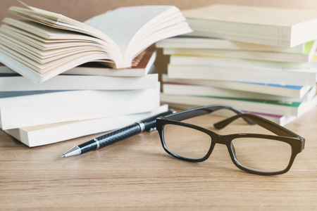 Stack of books on wooden table, Education backgroundの写真素材