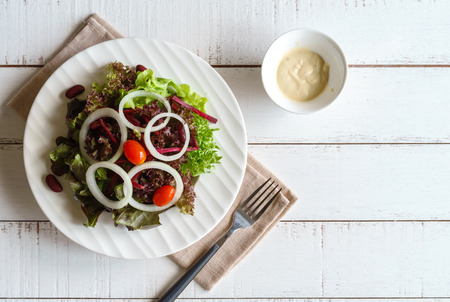 Close up of fresh hydroponic salad on white wooden tableの写真素材