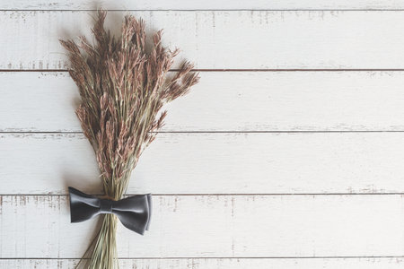 Bouquet of dried flowers on wooden background, Top view, Vintage toneの写真素材