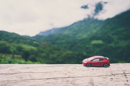 Red car with landscape background, Travel concept, Vintage toneの写真素材