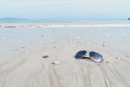 Sunglasses on the tropical beach with white sand, Travel relax vacationの写真素材