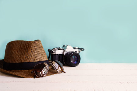 Hat, sunglasses with green background and copyspace, Travel conceptの写真素材