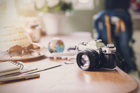 Retro camera on wooden table, Travel planning, Vintage toneの写真素材