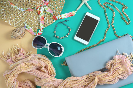 Fashion woman essentials, cosmetics, cellphone, makeup accessories isolated on colorful background,...