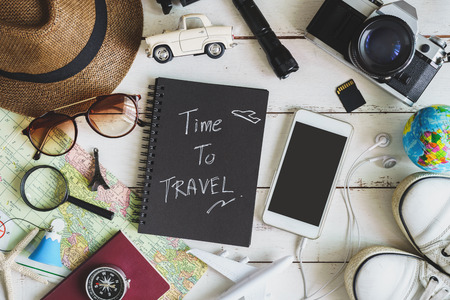 Overhead view of Traveler's accessories and items with black notebook and copyspace, Travel conceptの写真素材