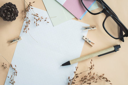 letters and dried flower in workspace with copy space with vintage filter effect