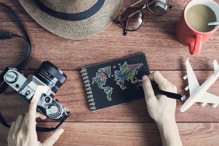 Overhead view of Traveler's accessories and items with black notebook and copy space, Travel conceptの写真素材