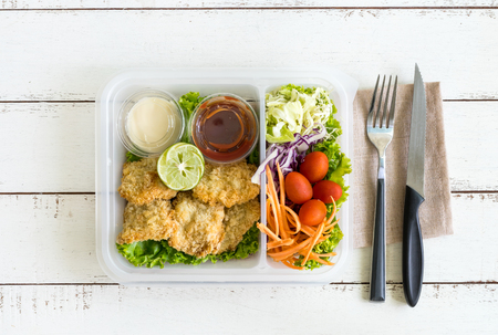 Crispy fried fish fillet with vegetablesの写真素材