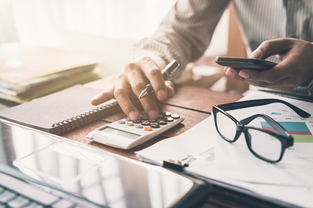Businessman working on Desk office business financial accounting calculateの写真素材