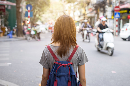 Young traveler with backpack at old quarter in Hanoi, Vietnamの写真素材