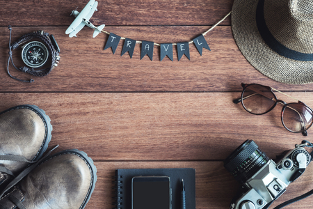 Overhead view of Traveler's accessories and items on wooden table and copy space, Travel conceptの写真素材