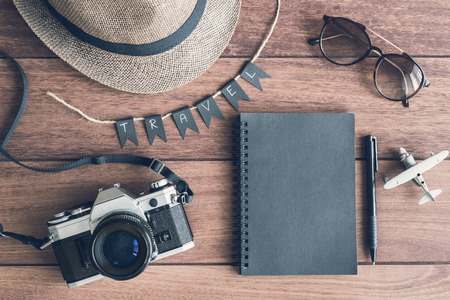 Overhead view of Traveler's accessories and items on wooden table and copy space, Travel conceptの写真素材