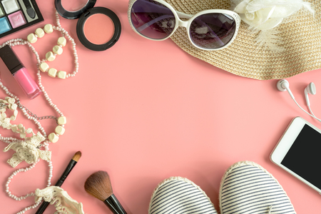 Woman stuff, makeup, cellphone and accessories isolated on pink background with copy space, Fashion conceptの写真素材