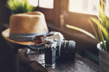 Retro camera with hat and sunglasses, Travel concept の写真素材