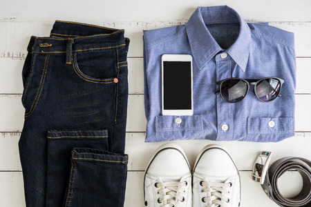 Men's casual outfits and accessories on white wooden background, Top viewの写真素材