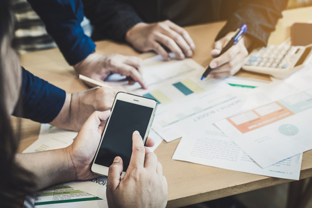 Coworkers team brainstorming and meeting to discuss and analysis the information together in office, Business conceptの写真素材