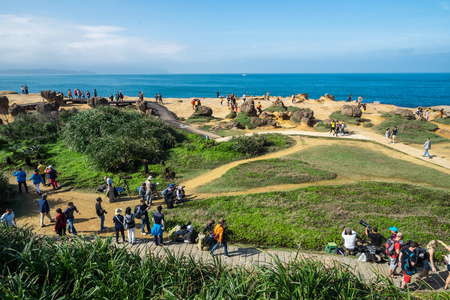 Taipei, Taiwan- November 16, 2017: Many tourists walk around the stone Strange shape at Yehliu Geopark in Taipeiのeditorial素材