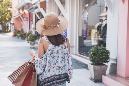 Young woman with shopping bags at shopping mall on black friday, Woman lifestyle conceptの写真素材