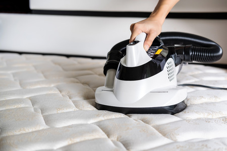Mite vacuum cleaner Cleaning bed mattress dust eliminatorの写真素材