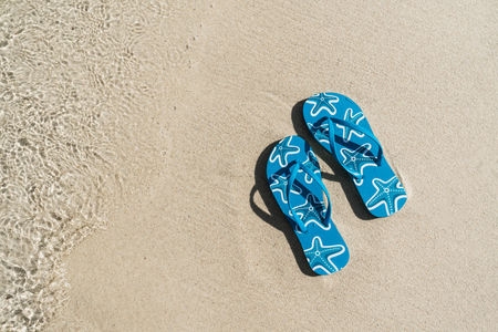 Flip flops on white sandy tropical beach, Summer vacation and travel conceptの写真素材