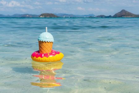 Tropical drinks floating on tropical sea with copy space, Summer vacation and travel concept