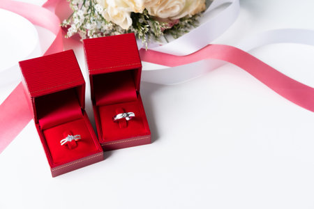 Wedding rings with bouquet of flowers