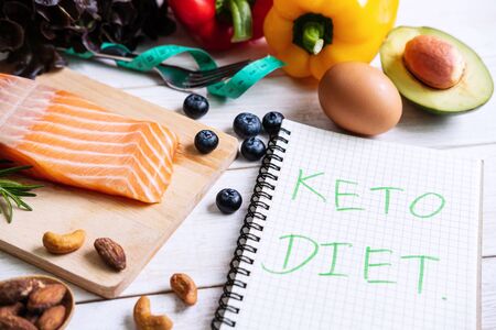 Healthy eating food with notebook, Ketogenic diet concept, Top viewの写真素材