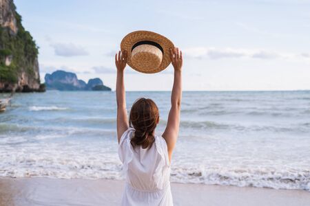 Young woman traveler enjoying a summer vacation at tropical sand beach in Krabi, Thailandの写真素材