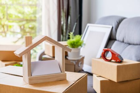 Stack of cardboard boxes in living room at new house on moving dayの写真素材