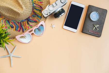 Travel accessories items with smartphone on color background and copy space, Summer vacation concept