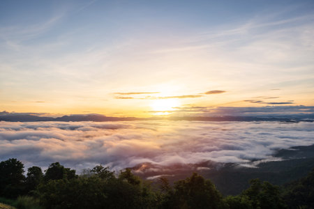 A beautiful sea of mist on the mountain in the morning at sunriseの写真素材