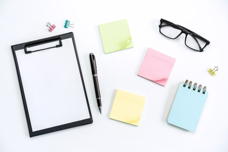 Business desk office with Goal, plan and action sticky notes on color background, Top view with copy spaceの写真素材