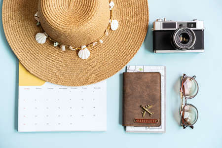 Travel items and calendar on color background with copy space, Vacation planning conceptの写真素材