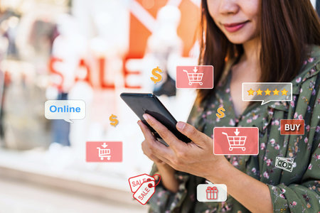 Young Asian woman using smartphone for making online payment shopping at the mall, Woman modern...
