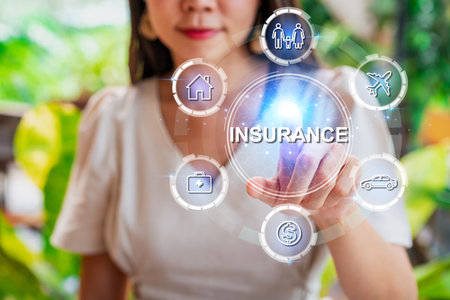 Young woman with virtual screen of insurance protection for house, car, life, family, travel and health, Insurance conceptの写真素材