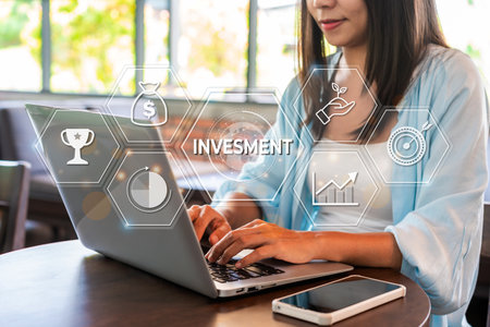 Businesswoman with a modern visual screen global network connection Graph analyzing financial growth and investment data planning conceptの写真素材