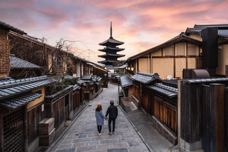 Young couple traveler looking at Yasaka Pagoda and Hokan-ji Temple, the famous tourist destination in Kyoto, Japanの写真素材