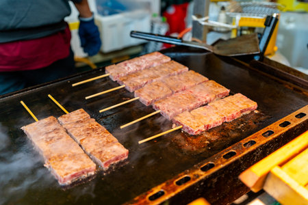 Grilled Wagyu Beef Skewers at fish market in Tokyo, Street food in Japanの写真素材