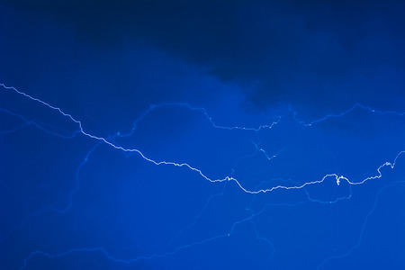 Lightning caught in the storm cloudsの写真素材