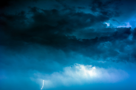 Lightning caught in the storm cloudsの写真素材
